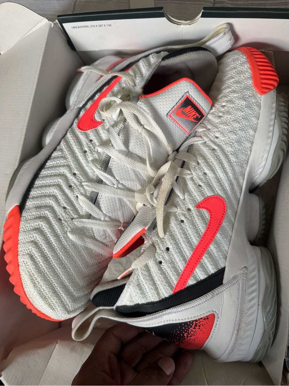 LeBron’s Nike White Sneakers with Bright Red Swoosh Accents